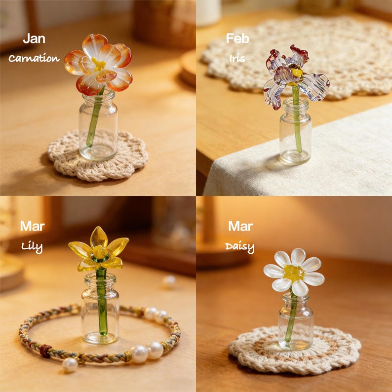 May include: Four glass flower sculptures in small glass bottles. The flowers are a carnation, iris, lily, and daisy. Each bottle sits on a decorative coaster or is surrounded by a bracelet. The text "Jan carnation", "Feb iris", "Mar lily", and "Mar daisy" is visible.