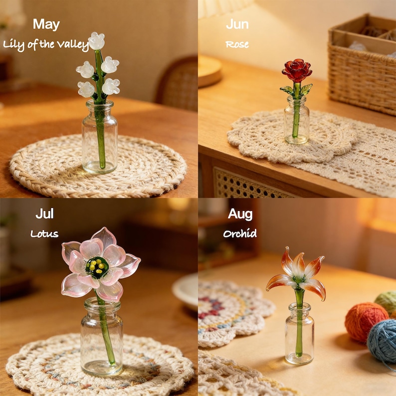 May include: Four glass flower sculptures in small vases, each representing a different month: May (Lily of the Valley), June (Rose), July (Lotus), and August (Orchid). The flowers are in clear glass vases on decorative mats.