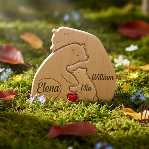 May include: Wooden bear family puzzle with the names "Elena", "Mia", and "William" engraved. The puzzle features a red heart and is set on a bed of green moss with fallen leaves and wildflowers.