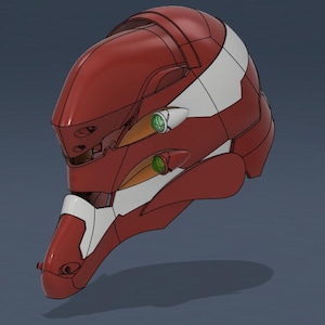 Puede incluir: Un casco rojo y blanco con detalles verdes, probablemente para cosplay o exhibición. El casco presenta un diseño segmentado con rayas blancas y elementos circulares verdes. La forma es aerodinámica y futurista.