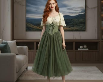 May include: A green tulle midi dress with a cream-colored bodice and short sleeves. The bodice features a corset-style design with a lace-up front. The dress is worn with white heels.