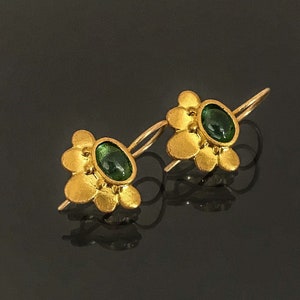 22k solid gold lotus earrings set with green tourmaline, handmade fine jewelry.