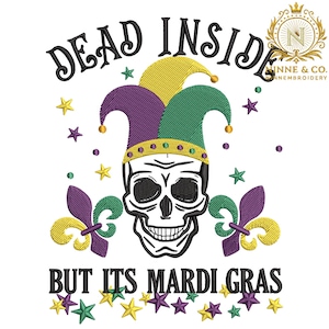 May include: Embroidered design featuring a skull wearing a jester's hat in purple, green, and yellow. The text reads "DEAD INSIDE BUT ITS MARDI GRAS" with star and fleur-de-lis accents. A fun, festive design.