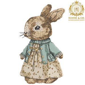 May include: An embroidered image of a bunny wearing a light blue jacket and a floral dress. The bunny has brown and tan fur, a blue collar, and a bow. The image includes the text "Ninne & Co. NinneEmbroidery."