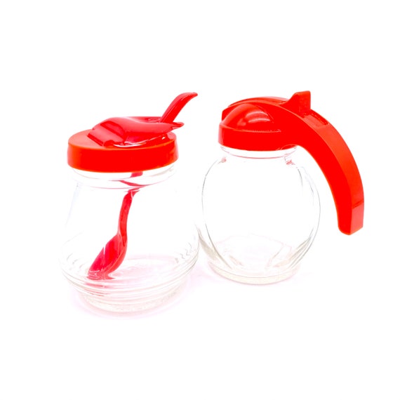 Vintage Hazel Atlas Glass Condiment Jar With Spoon and Glass Syrup  Dispenser Both Tops Are Made of Red Plastic 