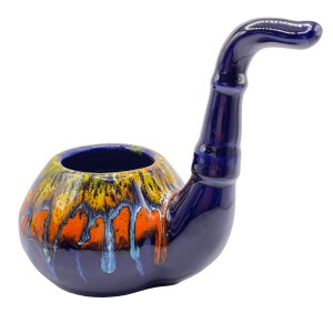 May include: A blue ceramic pipe with a yellow, orange, and white glaze. The pipe has a round bowl and a long, curved stem.