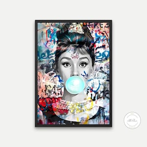 May include: A framed art print featuring a black and white portrait of a woman blowing a bubble. The background is a vibrant mix of graffiti art in various colors. The woman wears a tiara and a necklace.