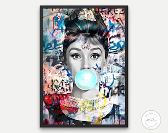 May include: A framed art print featuring a black and white portrait of a woman blowing a bubble. The background is a vibrant mix of graffiti art in various colors. The woman wears a tiara and a necklace.