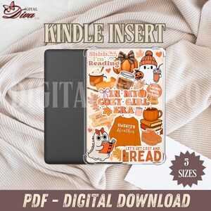 May include: A clear Kindle insert with a cosy autumn design. The insert features illustrations of pumpkins, a ghost reading a book, and the text "In My Cozy Girl Era." The words "Kindle Insert" and "PDF - Digital Download" are also visible.