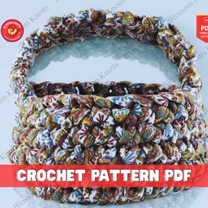 May include: A handmade crochet basket with a handle, crafted from fabric scraps in a colorful floral pattern. The basket features a sturdy construction and the text "CROCHET PATTERN PDF".