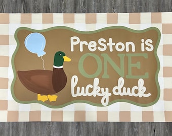One lucky duck first birthday banner