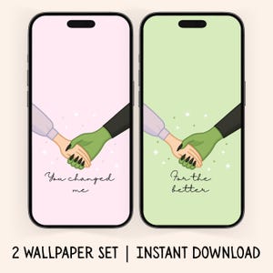 May include: Two smartphone screens displaying matching illustrations. One shows a pink background with a human hand holding a green hand, text reads "You changed me." The other has a green background with the same hands, text reads "For the better."