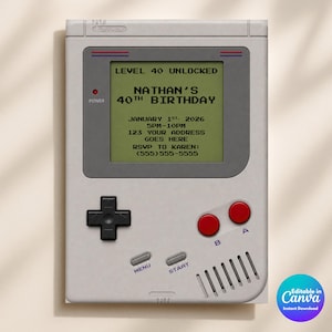May include: A light gray handheld gaming console invitation featuring a screen with the text LEVEL 40 UNLOCKED, NATHAN'S 40TH BIRTHDAY, JANUARY 1ST, 2026, 5PM-10PM, 123 YOUR ADDRESS GOES HERE, AND RSVP TO KAREN: (555)555-5555, with red buttons and a black D-pad.