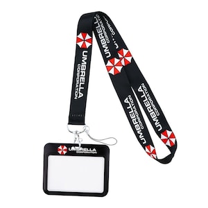 Horizontal ID badge holder with Umbrella Corporation lanyard, black frame card case for employee badges.
