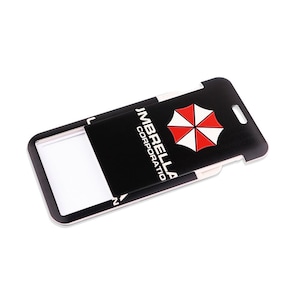 Closeup of sliding style ID card holder with Umbrella Corporation logo, protective cover for access key cards.