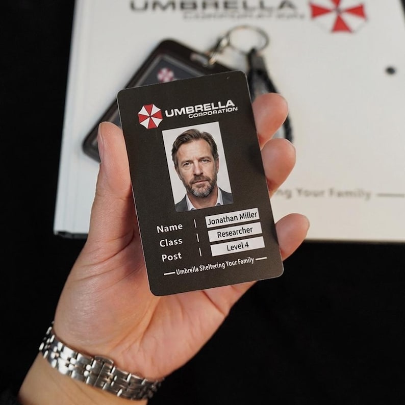Umbrella Corporation employee ID card close-up in hand, Resident Evil style badge insert for cosplay and work p