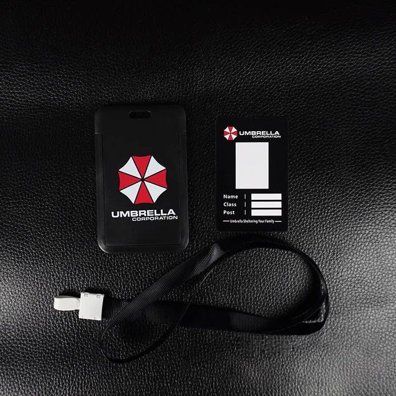 Black Umbrella badge holder with inner ID card and black neck lanyard, staff badge cover for office or con.