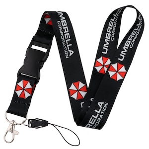 Umbrella Corporation black lanyard with quick release buckle, red white logo strap for badges and keycards.