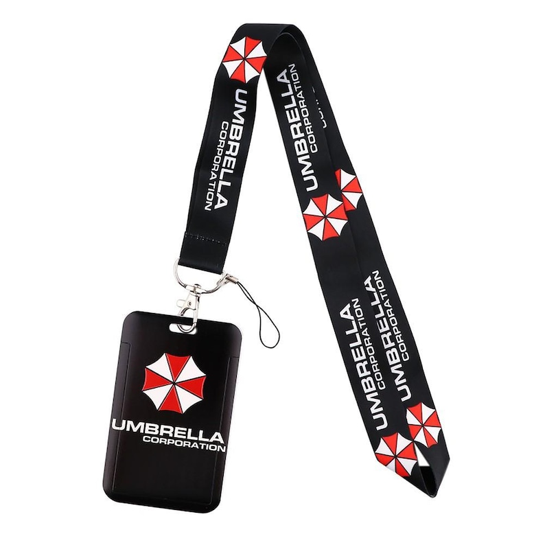Vertical Umbrella Corporation ID badge holder with black lanyard, hard case card protector for keycard access.