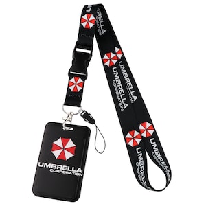 Umbrella Corporation lanyard with vertical ID holder and buckle, black strap for work badge and door access card.