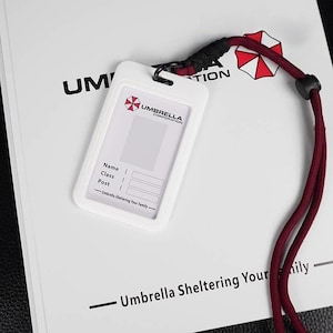 White Umbrella badge holder with red rope strap on white folder, employee ID holder for fans and cosplay.