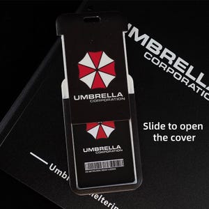Slide-to-open Umbrella badge holder showing inner card, protective ID cover for keycards and work badges.