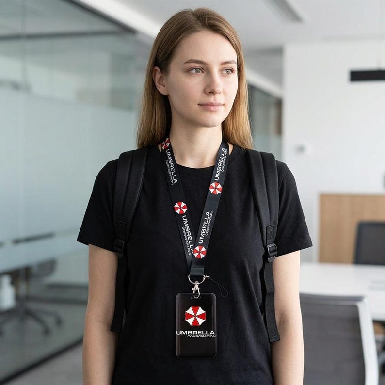Woman wearing Umbrella Corporation lanyard with black ID holder, keycard badge case for office and campus use.