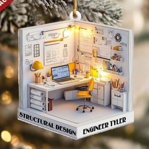 May include: A white acrylic ornament shaped like a miniature office, featuring a desk with a laptop, a yellow chair, and architectural plans. Text reads "STRUCTURAL DESIGN ENGINEER TYLER" and "2D FLAT ACRYLIC ITEM".