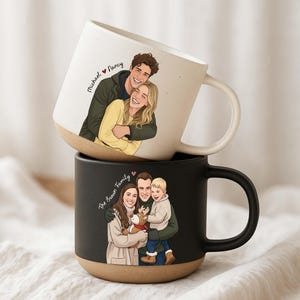 May include: Two ceramic mugs stacked on top of each other. The top mug is white with a tan base and features a couple illustration with the names "Michael" and "Nancy". The bottom mug is black with a tan base and features a family illustration with the text "The Brown Family".