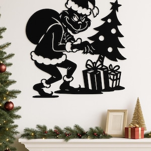 May include: Black metal wall art depicting a character in a Santa hat, carrying a sack and interacting with a Christmas tree and presents. The artwork is a silhouette, perfect for holiday decor.