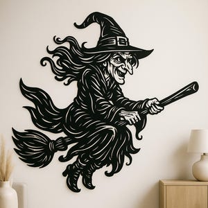 May include: Black metal wall art of a witch riding a broom. The witch is wearing a pointed hat and a long dress, with long flowing hair. The artwork is a silhouette, with intricate details.