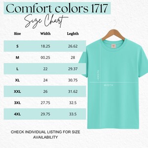 May include: A Comfort Colors 1717 size chart featuring a light teal t-shirt on a wooden hanger. The chart lists sizes S through 4XL with corresponding width and length measurements in inches. Text includes Comfort Colors 1717 Size Chart.