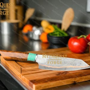 May include: A chef's knife with a wooden handle and a decorative green accent, resting on a wooden cutting board. The blade has a unique pattern and the text "MythQuest Forge" is visible.