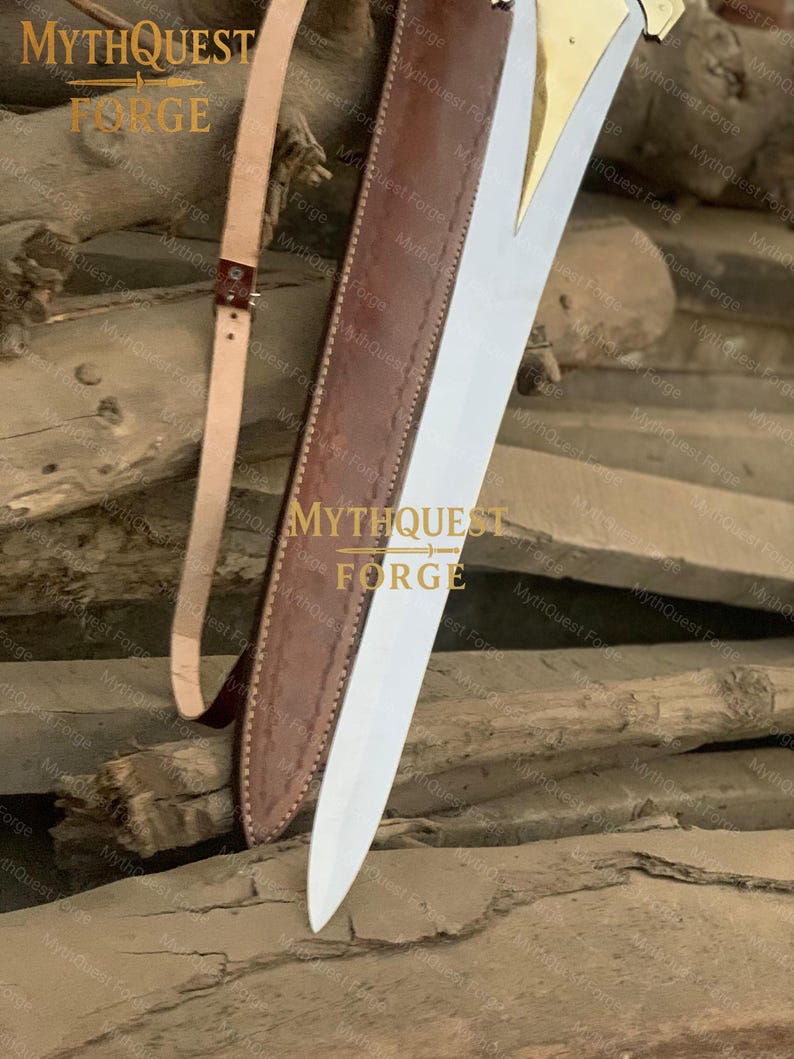 May include: A sword with a polished steel blade and a gold-colored hilt is partially sheathed in a brown leather scabbard. A tan leather strap is attached. The text "MYTHQUEST FORGE" is visible.