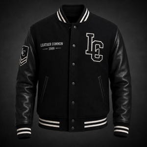 May include: A black varsity jacket with black leather sleeves and a black wool-blend body. The jacket features white striped ribbed cuffs, collar, and hem. It displays white embroidered text reading LEATHER COMMON 1986 and a large white LC logo.