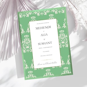 May include: A mint green invitation with a decorative border and a central panel. The text reads "MEHENDI of ALIA & SUSHANT" with event details. The invitation is set against a soft, neutral background with floral accents.