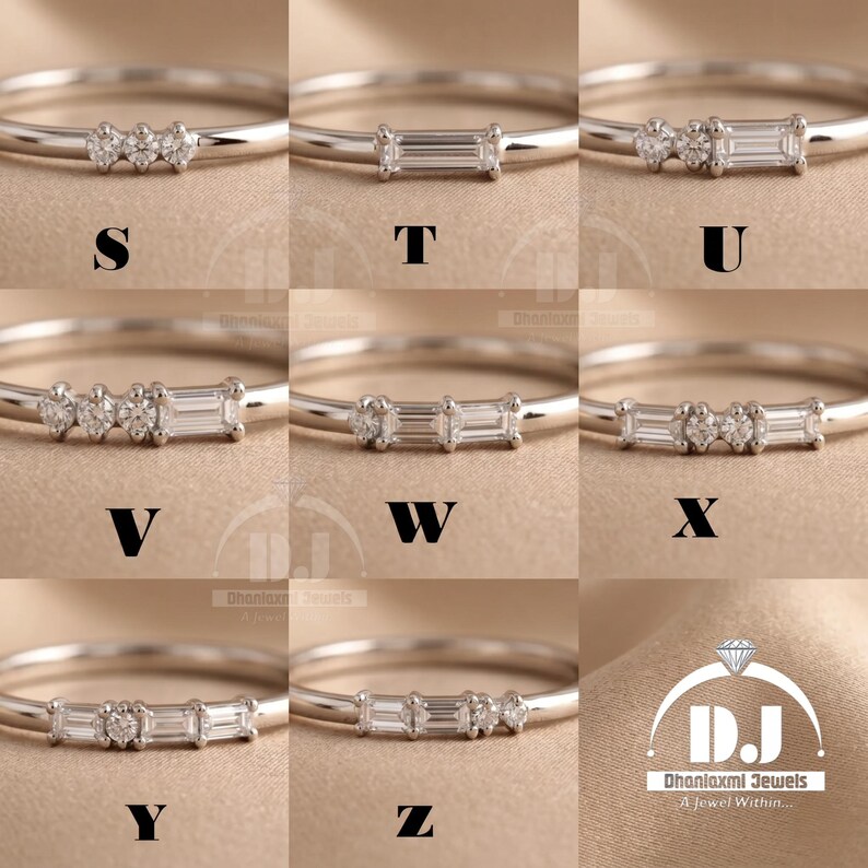 May include: Nine silver rings, each with a different design of small, clear gemstones. The rings are presented against a neutral backdrop. The letters S, T, U, V, W, X, Y, and Z are displayed on the rings. The Dhanlaxmi Jewels logo is in the bottom right.
