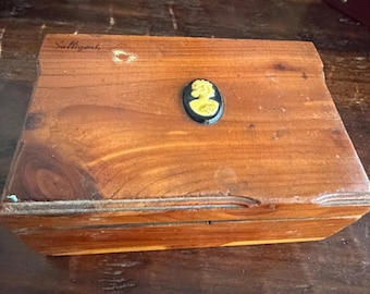 Vintage wooden box with cameo on it