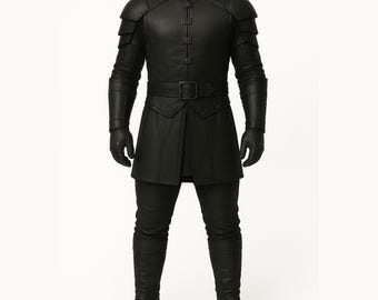 May include: A full-length image of a black leather outfit. The ensemble features a high-collared jacket with shoulder armour, a belted waist, and a tunic-style bottom. Matching trousers, gloves, and knee-high boots complete the look. The outfit has a medieval or fantasy design.