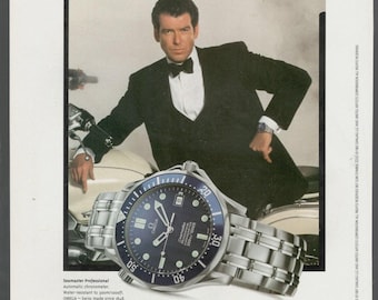 Zegarek OMEGA SEAMASTER James BOND OO7 Pierce Brosnan 1 strona Reklama 1997 oryginał do oprawienia prezent dla kolekcjonerów przedmiotów vintage