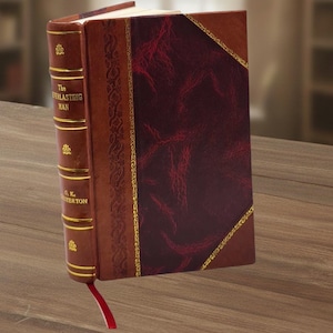 May include: A hardcover book titled "The Everlasting Man" by G.K. Chesterton. The book has a brown leather cover with gold accents and a red bookmark. The cover features a burgundy textured panel.
