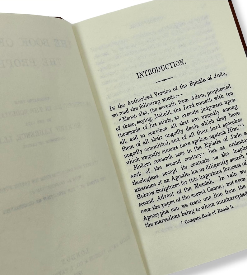 May include: Open book with text on cream-colored pages. The text reads "INTRODUCTION" at the top, followed by paragraphs discussing the Epistle of Jude and the Book of Enoch. The book has a brown cover.