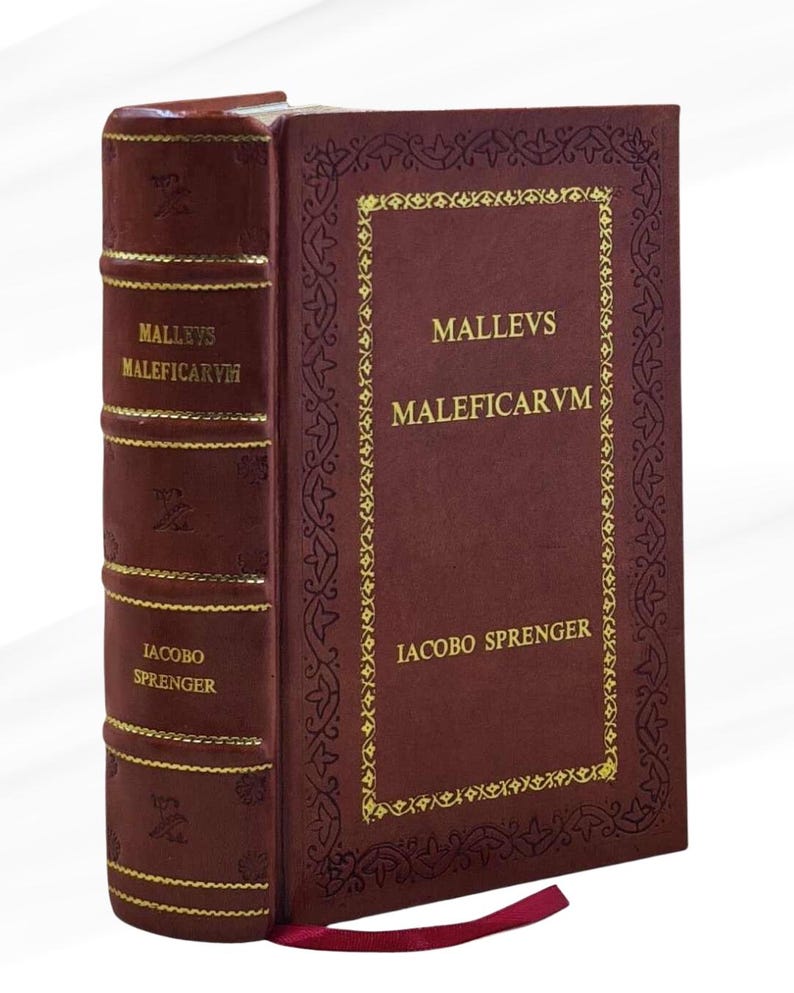 May include: A hardcover book with a burgundy cover and gold lettering. The title "MALLEVS MALEFICARVM" is displayed on the cover and spine. The author's name, IACOBO SPRENGER, is also visible. A red ribbon bookmark is included.