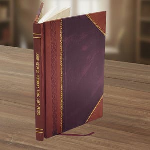 May include: A hardcover book with the title "JOHN GEORGE HOHMAN'S LONG LOST FRIEND" in gold lettering. The book has a burgundy cover with a dark purple center panel, accented with gold trim. A burgundy ribbon bookmark is visible.