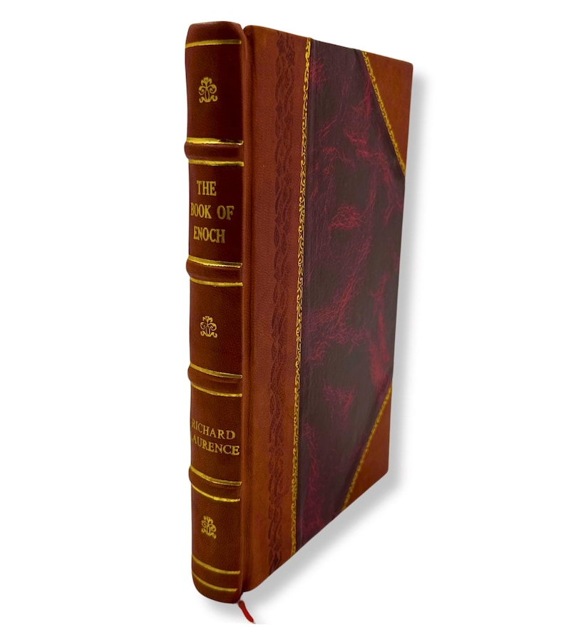 May include: A hardcover book titled "THE BOOK OF ENOCH" by Richard Laurence. The book has a burgundy leather cover with gold accents and a red ribbon bookmark. The spine features gold lettering and decorative elements.