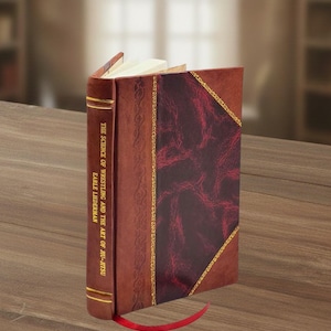 May include: A hardcover book titled "The Science of Wrestling and the Art of Jiu-Jitsu" by Earle Lieberman. The book has a brown cover with a burgundy diamond-shaped design and gold trim. A red ribbon bookmark is visible.