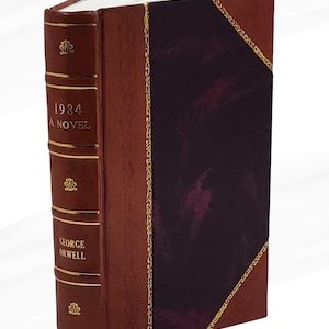 May include: A hardcover book titled "1984 A Novel" by George Orwell. The book has a brown leather cover with gold accents and a dark burgundy panel. A red ribbon bookmark is visible.