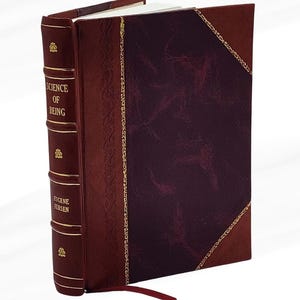 May include: A hardback book titled "SCIENCE OF BEING" by Eugene Fersen. The book features a burgundy leather cover with gold detailing and a red ribbon bookmark. The spine and edges are a darker shade of burgundy.