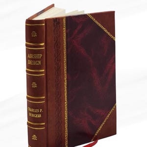 Puede incluir: Un libro de tapa dura con una cubierta de cuero burdeos y marrón. El lomo dice "AIRSHIP DESIGN" y "CHARLES P. BURGESS" en letras doradas. Una cinta roja como marcador de libros se extiende desde las páginas. La cubierta tiene un diseño en forma de diamante.