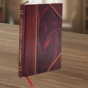 Op de afbeelding: Een hardcover boek getiteld "THE CODE DUELLO" door A.W. Patterson. Het boek heeft een bordeauxrode leren kaft met gouden accenten en een rood lint als boekenlegger. De kaft heeft een textuurpatroon en gouden decoratieve rand.